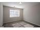 Neutral bedroom filled with natural light from the bright window and featuring carpeted floors at 3049 Flat Shoals Rd, Atlanta, GA 30349