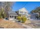 Two-story home with neutral siding, black shutters, and manicured bushes in the front yard at 3049 Flat Shoals Rd, Atlanta, GA 30349