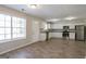 Bright kitchen features white cabinets, stainless steel appliances, and wood-look flooring at 3049 Flat Shoals Rd, Atlanta, GA 30349
