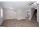 Open-concept living space with hard surface flooring, neutral walls, and a ceiling fan at 3049 Flat Shoals Rd, Atlanta, GA 30349