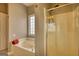 Bathroom with a large tub, glass shower, and natural light from a window at 2683 Mariner Way, Villa Rica, GA 30180