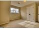 Bedroom with a large window, double door closet, and neutral carpeting at 2683 Mariner Way, Villa Rica, GA 30180