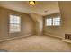 Bedroom with natural light, carpet floors, and unique ceiling architecture at 2683 Mariner Way, Villa Rica, GA 30180
