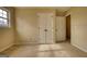 Bedroom with a large window, double door closet, and neutral carpeting at 2683 Mariner Way, Villa Rica, GA 30180