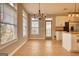 Bright dining room with hardwood floors is conveniently located near the kitchen and back door at 2683 Mariner Way, Villa Rica, GA 30180