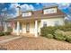 Inviting two-story home with front porch, decorative columns, and meticulously maintained landscaping at 2683 Mariner Way, Villa Rica, GA 30180
