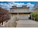 Two-story home features a garage and a second-floor deck, with a fenced yard at 2683 Mariner Way, Villa Rica, GA 30180