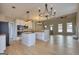 Open concept kitchen with white cabinets, island, and stainless steel appliances at 2683 Mariner Way, Villa Rica, GA 30180