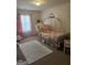 Bedroom with natural light, carpet floors, and soft colored walls at 2764 Keystone Ave, Lithonia, GA 30058
