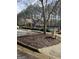 The clubhouse offers a sparkling swimming pool, mature trees, black metal fence, and convenient parking at 2764 Keystone Ave, Lithonia, GA 30058