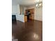 Spacious dining room featuring wood flooring, a fireplace, and an open layout to the kitchen at 2764 Keystone Ave, Lithonia, GA 30058