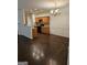 Open-concept dining area with hardwood floors, a chandelier, and wooden wainscoting at 2764 Keystone Ave, Lithonia, GA 30058