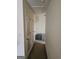 Hallway with carpet floors, white walls, and white trim at 2764 Keystone Ave, Lithonia, GA 30058