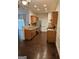 Well-lit kitchen featuring wooden cabinets, stainless steel appliances, and dark wood floors at 2764 Keystone Ave, Lithonia, GA 30058