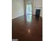 Bright living room with hardwood floors, fireplace, and sliding door to the outdoors at 2764 Keystone Ave, Lithonia, GA 30058