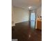 Spacious living room featuring hardwood floors and access to the outdoors through sliding glass doors at 2764 Keystone Ave, Lithonia, GA 30058