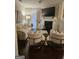 Bright living room featuring a fireplace, large screen TV, comfortable seating, and elegant décor for a relaxed atmosphere at 2764 Keystone Ave, Lithonia, GA 30058