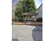 The property has a convenient, covered mailbox station with mature landscaping near residential parking at 2764 Keystone Ave, Lithonia, GA 30058