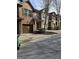 Townhouses lining the street, each with attached garages, covered entrances, and minimal landscaping at 2764 Keystone Ave, Lithonia, GA 30058