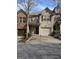 Charming townhouse with attached garage, neat landscaping, and a cozy front entrance at 2764 Keystone Ave, Lithonia, GA 30058