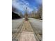 A long and beautifully landscaped street view offers a tranquil and inviting atmosphere for residents and visitors alike at 2764 Keystone Ave, Lithonia, GA 30058