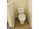 Close-up view of a standard white toilet with a matching tile floor at 2764 Keystone Ave, Lithonia, GA 30058