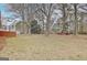 Expansive backyard featuring mature trees and ample space, perfect for outdoor activities and future landscaping at 205 Medford Dr, Fayetteville, GA 30215