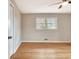 Bright bedroom with hardwood floors, large window, a ceiling fan, and closet access at 205 Medford Dr, Fayetteville, GA 30215