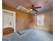 Bedroom with a colorful ceiling fan, window, and doorway for easy access to other areas at 700 Appleton Se Dr, Marietta, GA 30008