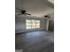 Spacious living room featuring modern gray walls, updated flooring and plenty of natural light at 480 Pine Pl, Riverdale, GA 30274