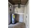 Water heater in an unfinished room, awaiting final touches and ready for use at 480 Pine Pl, Riverdale, GA 30274