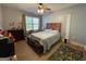 Bright bedroom with a large window, cute decor, and wood-look flooring at 306 Oakwind Way, Canton, GA 30114