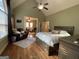 Main bedroom with vaulted ceiling, natural light, and comfortable seating area at 306 Oakwind Way, Canton, GA 30114