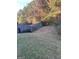 View of a backyard with a wooden fence and lawn at 5620 Sable Way, Atlanta, GA 30349