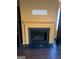 Traditional fireplace with black mantel and hearth, surrounded by bright wall color at 5620 Sable Way, Atlanta, GA 30349