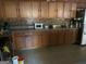 Functional kitchen with tile backsplash, ample cabinet space, and stainless-steel appliances at 5620 Sable Way, Atlanta, GA 30349