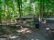 Backyard chicken coop on a wooded lot with mature trees and wire surround at 613 Rock Springs Pass, Dallas, GA 30157