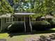 Charming home featuring a covered front porch, lush landscaping, and a well-maintained lawn at 12641 Alcovy Rd, Covington, GA 30014