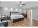 This spacious main bedroom features beautiful wood floors and tray ceilings with recessed lighting at 13789 Woolsey Rd, Hampton, GA 30228