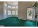 Bright living room featuring a chandelier and several windows at 787 N Ola Rd, Mcdonough, GA 30252