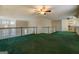 Spacious living room with kitchen on the side and second floor railing at 787 N Ola Rd, Mcdonough, GA 30252