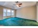 Spacious main bedroom boasts a tray ceiling, ceiling fan and a bay window letting in natural light at 787 N Ola Rd, Mcdonough, GA 30252