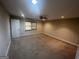 Spacious carpeted bedroom features a ceiling fan and window with woven shades at 120 Creekwood Ln, Fayetteville, GA 30214