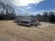 Rear view of the house showing screened porch and large yard at 120 Creekwood Ln, Fayetteville, GA 30214