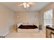 Neutral bedroom with large windows and daybed with storage drawers at 925 Whitehawk Trl, Lawrenceville, GA 30043