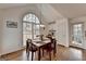 Bright dining area featuring hardwood floors and large windows for a welcoming dining experience at 925 Whitehawk Trl, Lawrenceville, GA 30043