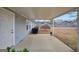 Covered patio overlooking a large, fenced backyard with mature trees at 11531 E Lovejoy Rd, Hampton, GA 30228