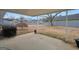Fenced backyard featuring a decorative tree and patio at 11531 E Lovejoy Rd, Hampton, GA 30228