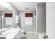 Modern bathroom with a large vanity, tiled floors, and a shower at 11531 E Lovejoy Rd, Hampton, GA 30228