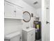 Cozy bathroom featuring a vanity with cabinet storage, toilet, and water heater with easy access for maintenance at 11531 E Lovejoy Rd, Hampton, GA 30228